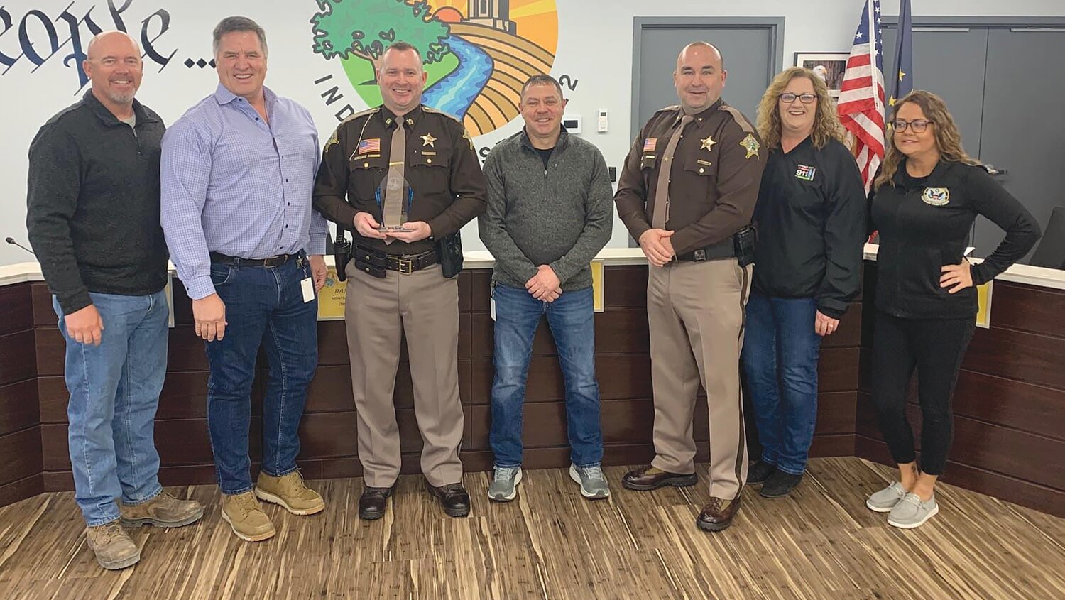 Montgomery County Jail Commander Travis King, pictured third from left, was named Montgomery County Employee of the Year on Monday. He is pictured with, from left, Commissioners Dan Guard, John Frey and Jim Fulwider, Sheriff Ryan Needham, Dispatch Director Sherri Henry and EMA Director Jessica Burget.