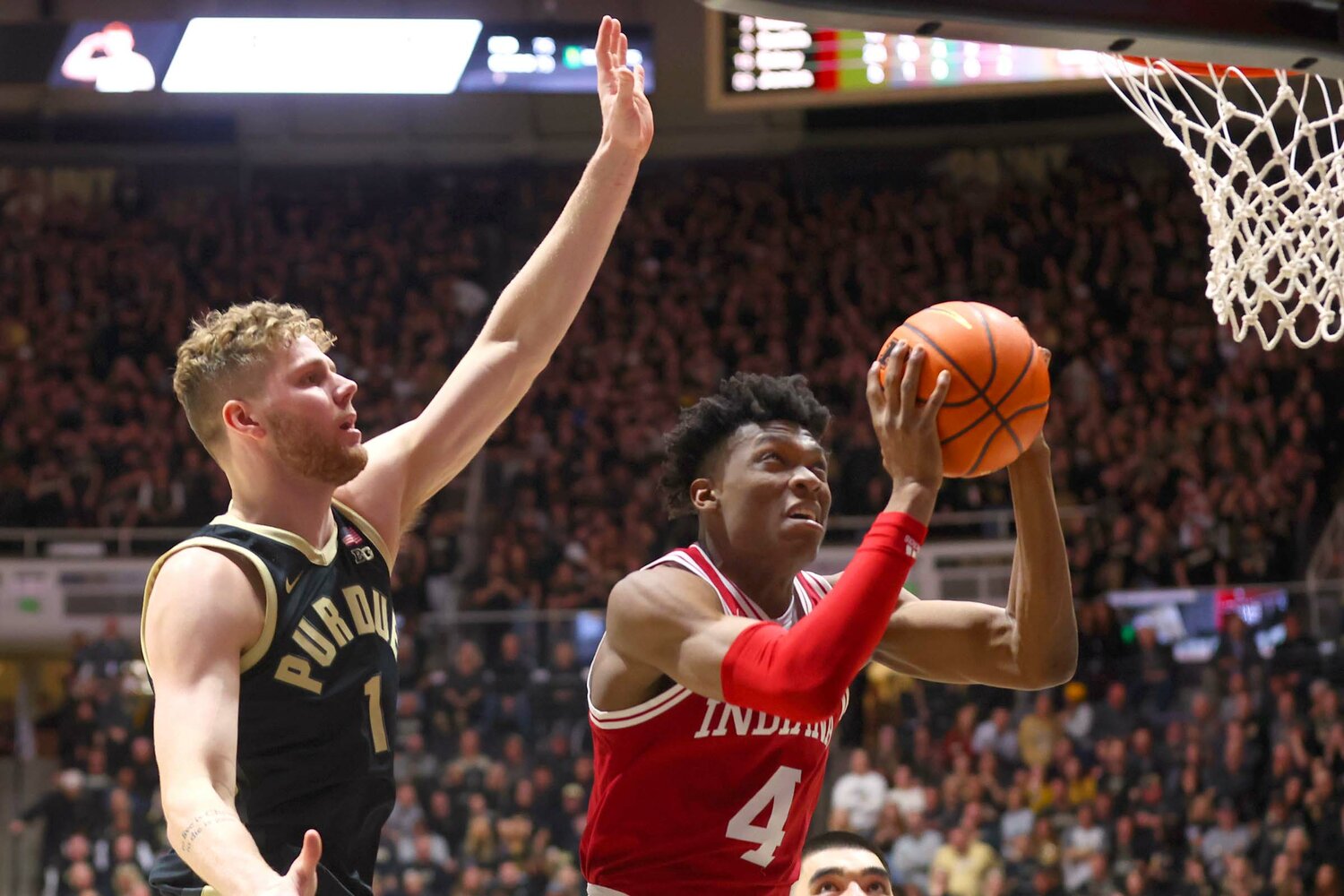 Anthony Walker of Indiana - going up for a lay-up as Caleb Furst of Purdue closes in