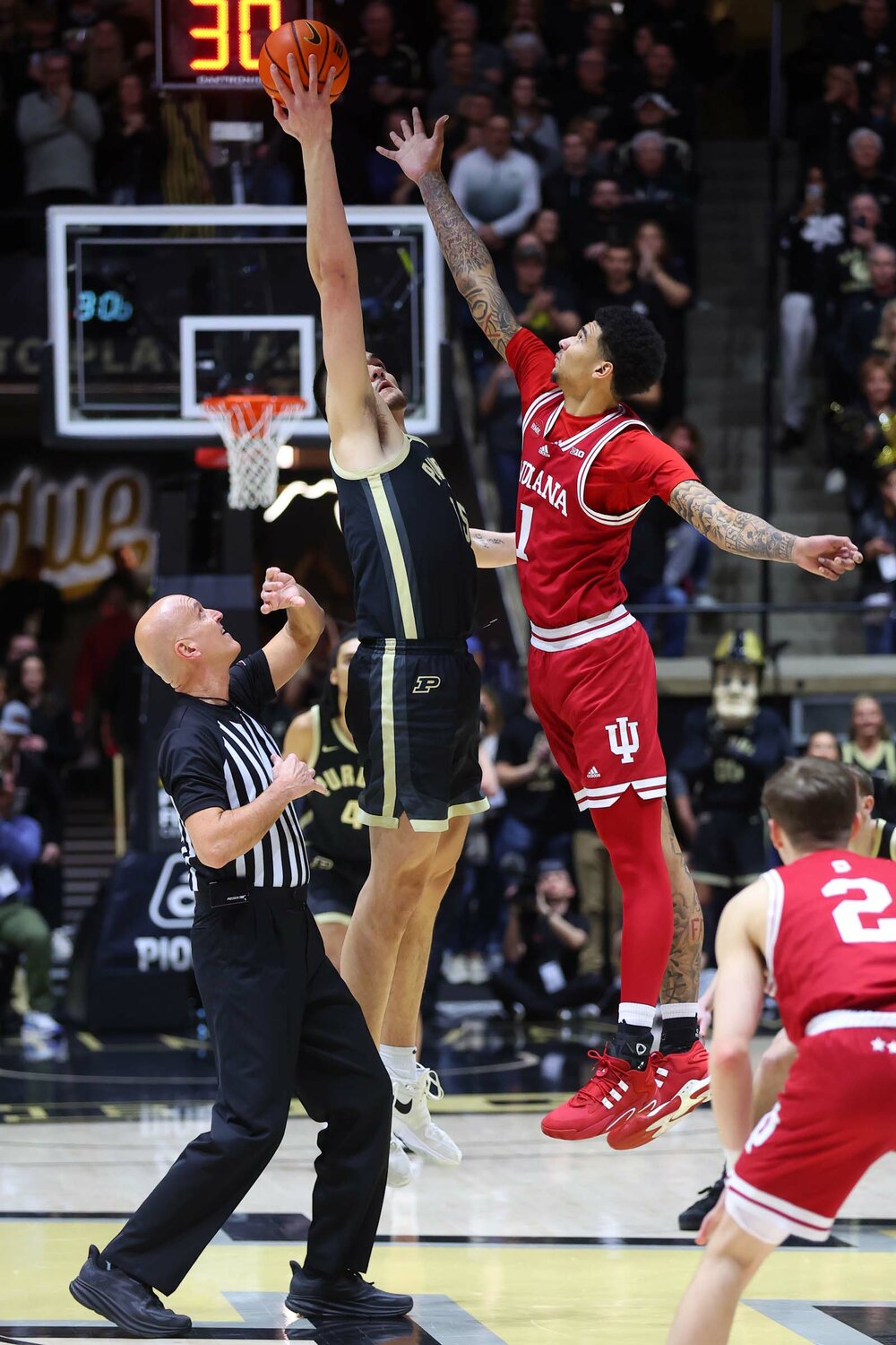 Zach Edey of Purdue - out jumping Kel'el Ware of Indiana on the center jump