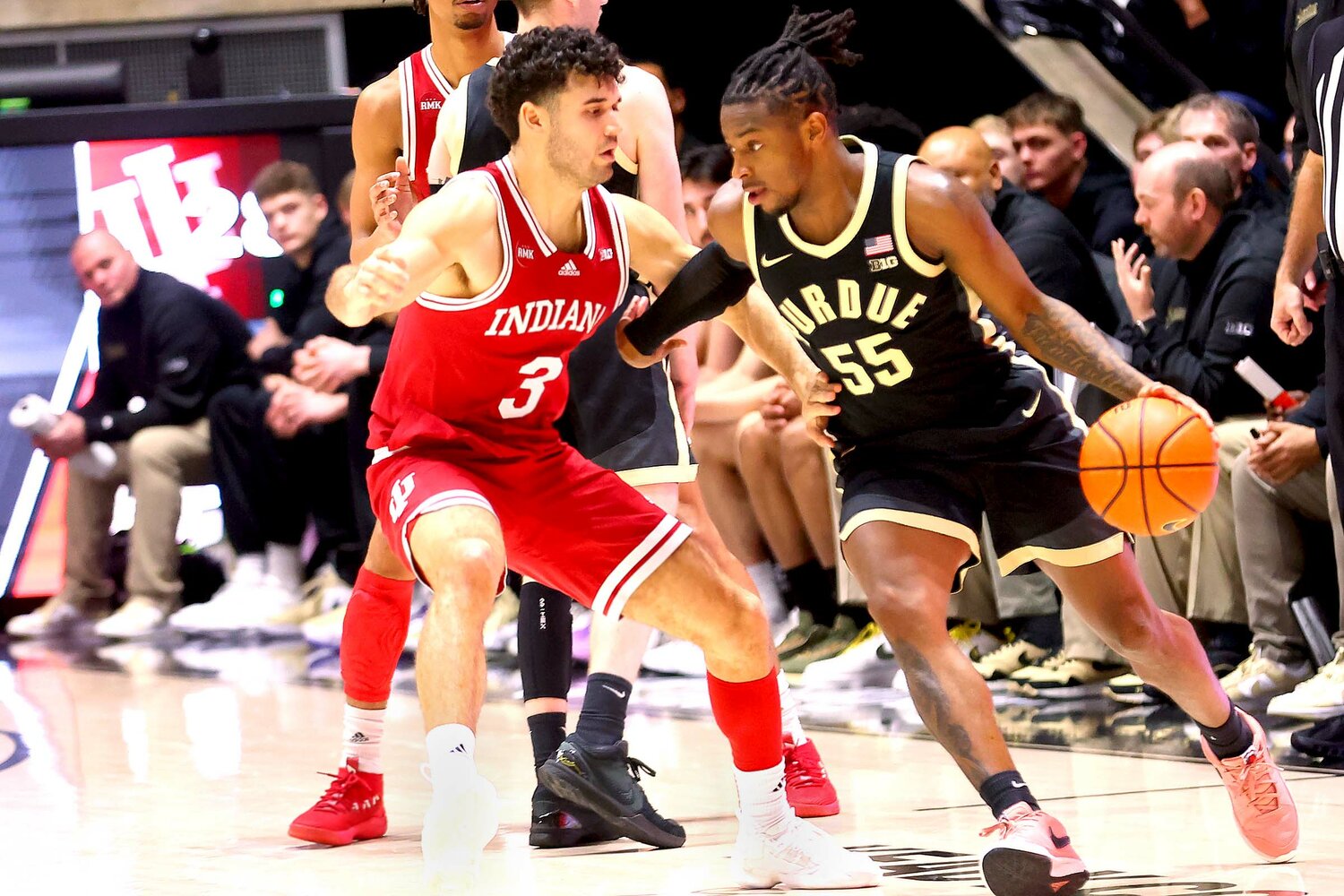 Lance Jones of Purdue - driving around Anthony Leal of Indiana