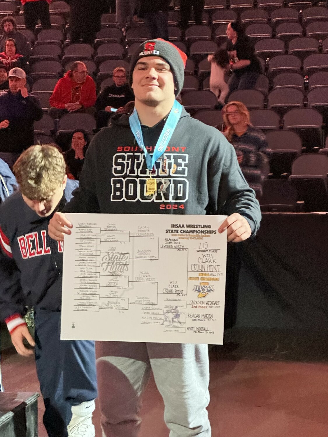 Southmont senior Wyatt Woodall stands on the podium as he concludes his career with a 7th place finish at 215 pounds at the IHSAA Wrestling State Finals.