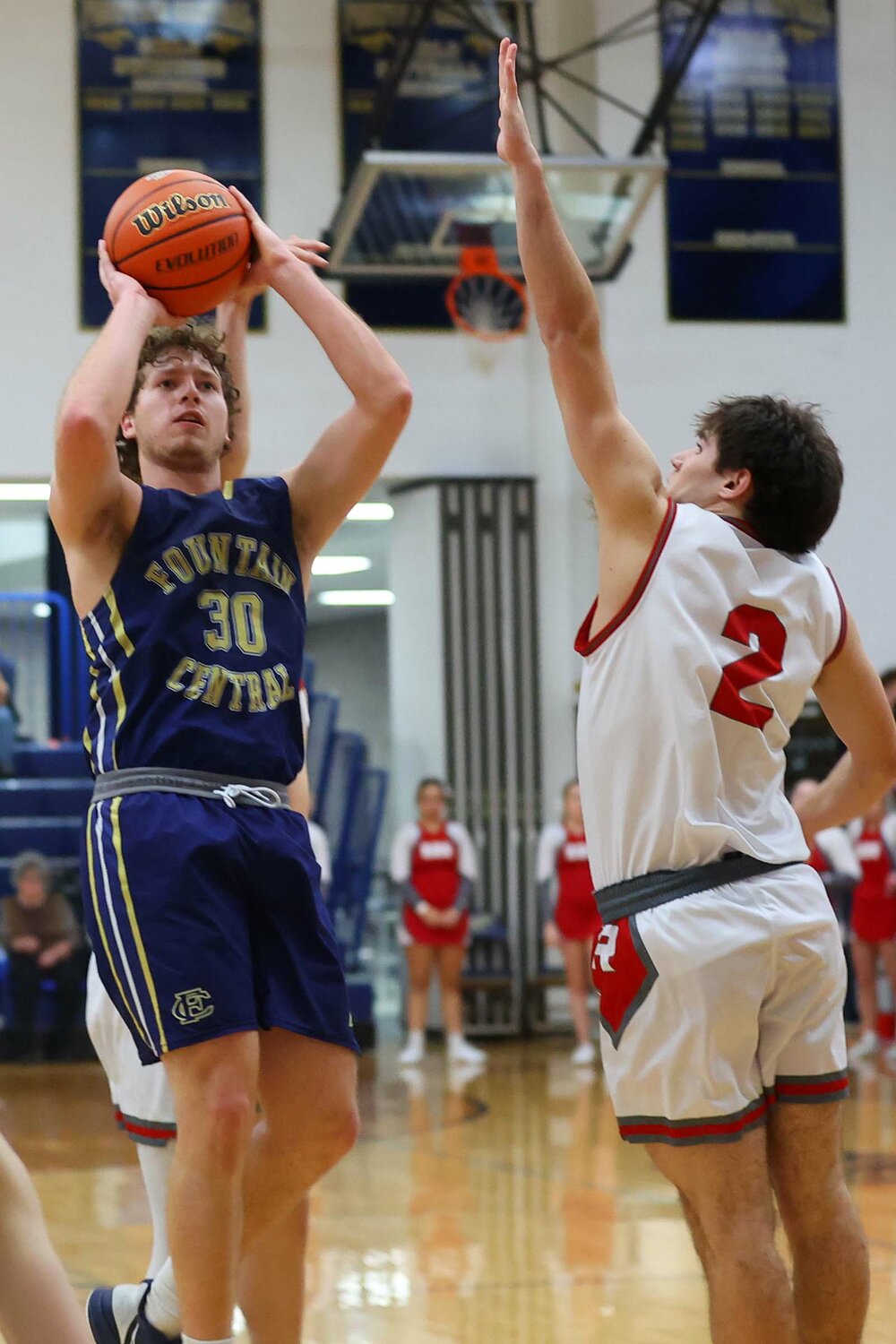 Owen Acton of Fountain Central - shooting a jumper over Matthew Ford of Rossville
