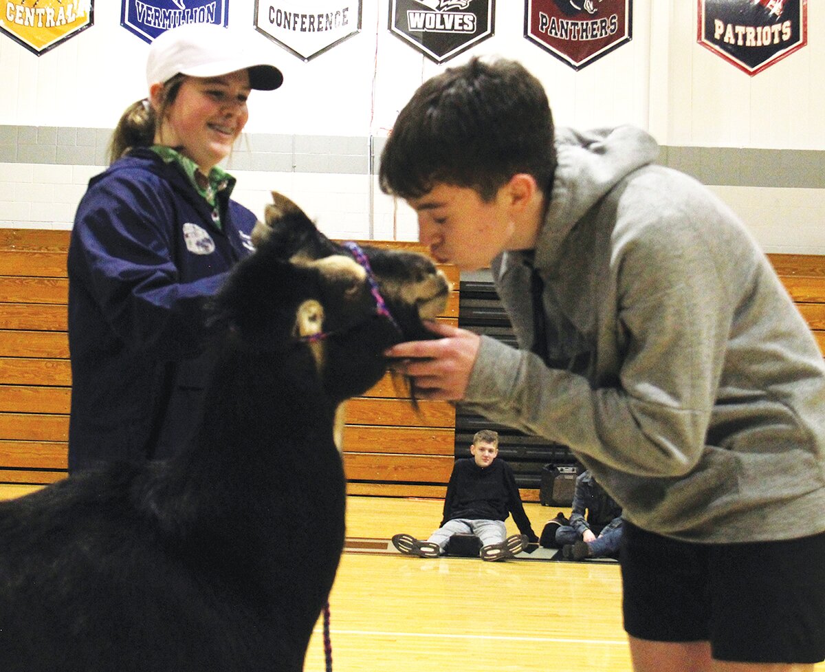 At Parke Heritage Middle School, the FFA chapter members held a “Kiss the Goat’’ event for FFA Week. Students voted for staff members to be the lucky ones to kiss “Nacho,” the goat. FFA member Landon Berry raised the most money with $143.17 to be the officer member to kiss the goat. Max Jeffries was second and Kamden Shields came in third. For the staff voting, the “new kid on the block,” Shawn Goldsberry won top honors. Also kissing Nacho were Mrs. Lisa Wrightsman, school resource officer Tyler Milner and Mrs. Kylie Gates. Students were also invited to guess the number of kernels in a glass jar, which held 1,747 pieces of corn. Emmylou Rader was only off by six guessing 1,753. Second place was Kennedy Mitchell and third place was tie between Mikey Clockson and Max Jeffries. Pictured are Kennedy Mitchell and Landon Berry.