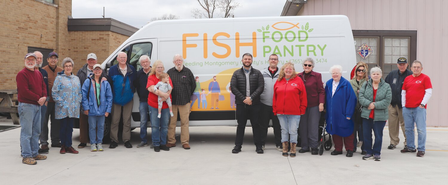 FISH Food Pantry board members and volunteers along with York dealership employees, celebrated delivery of a new van this week. The van was made possible by a gift through Montgomery County Community Foundation.