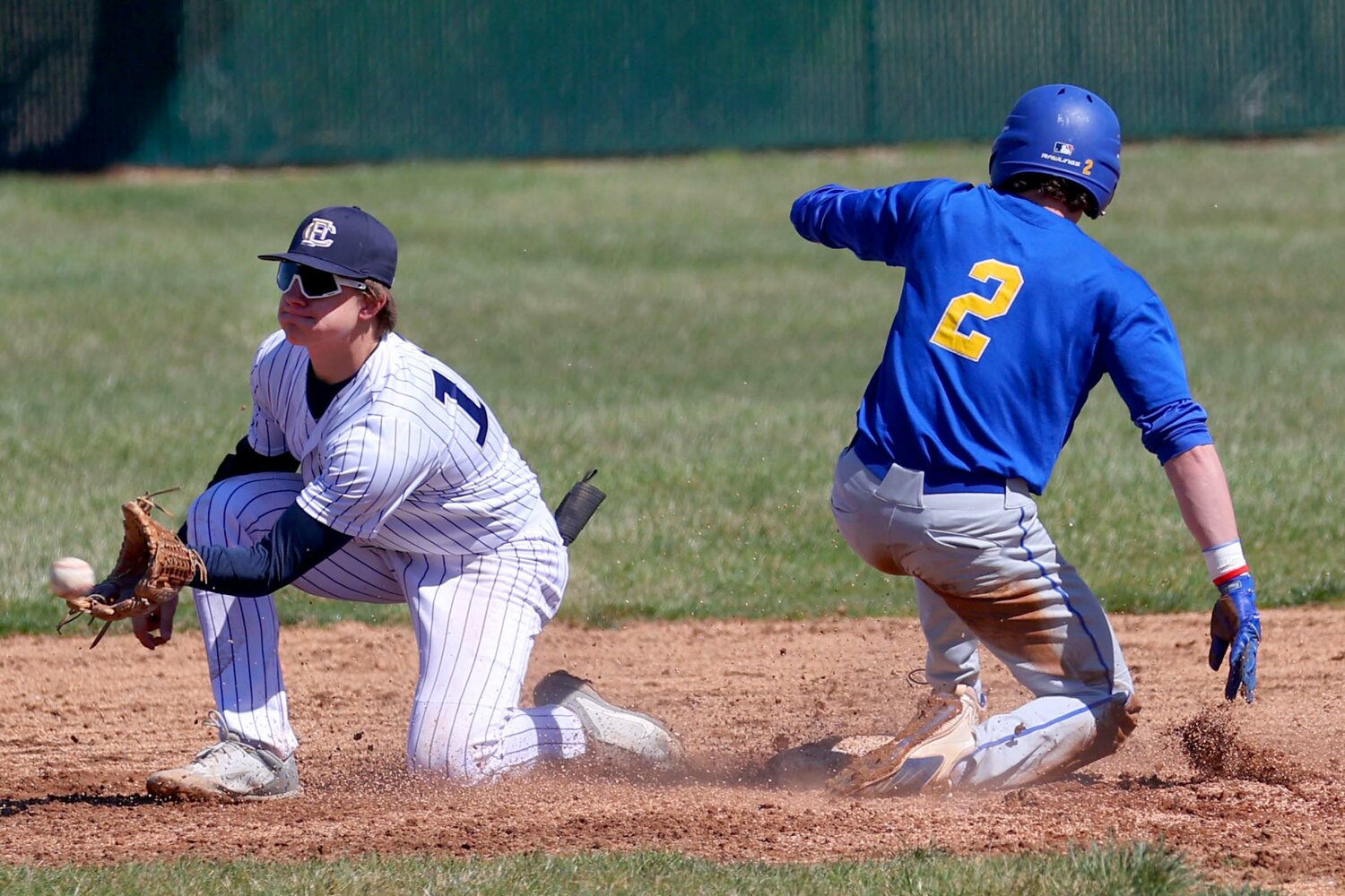 Wyatt Motz of Crawfordsville - sliding into second base ahead of the throw to Ayden Batchelor of Fountain Central