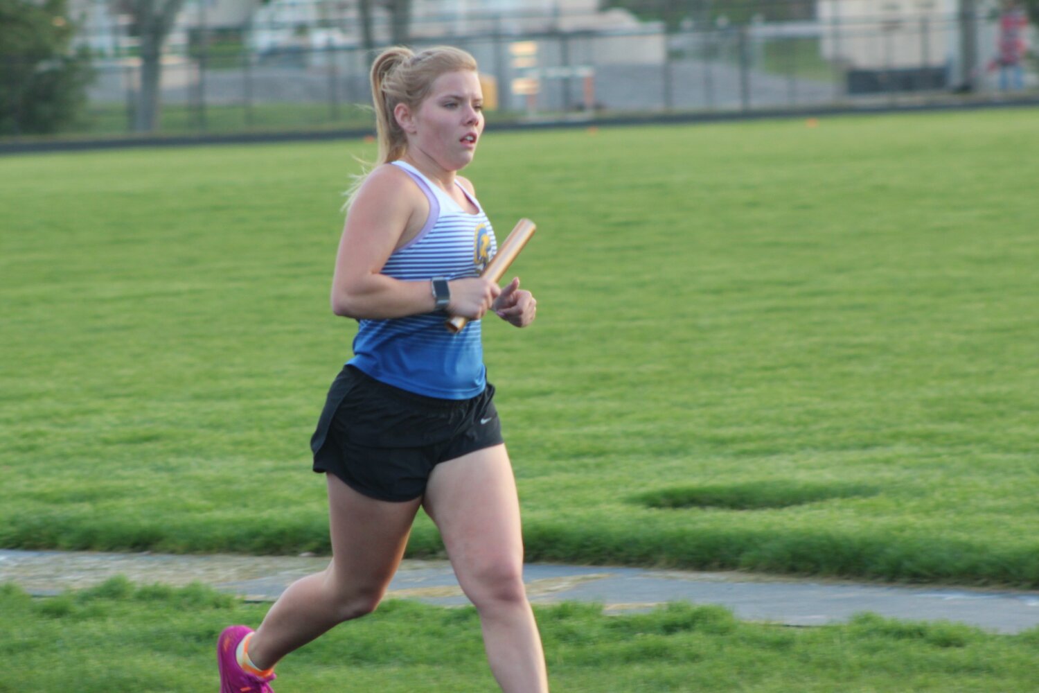 Crawfordsville's Gabby Warren runs in the girls distance medley relay.