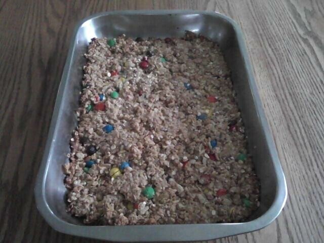 Pictured is homemade Amish granola bars (pressed in the pan
before the chocolate is poured over it).
