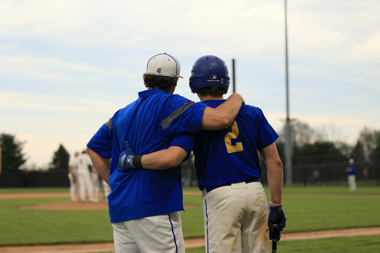 Crawfordsville coach Brett Motz and son Wyatt share a moment during their victory over the Bruins.