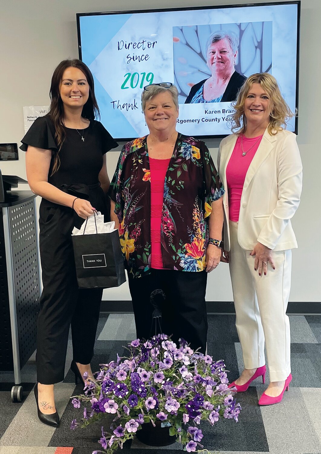 Karen Branch, center, was recognized for completing the term limit as a board director, having served since 2019. She is pictured with KyLee Risner, left, and Stacy Sommer.
