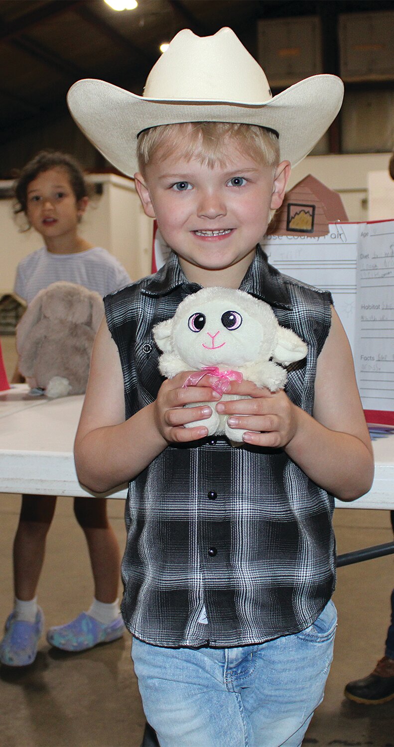 Tripp is pictured with his sheep.