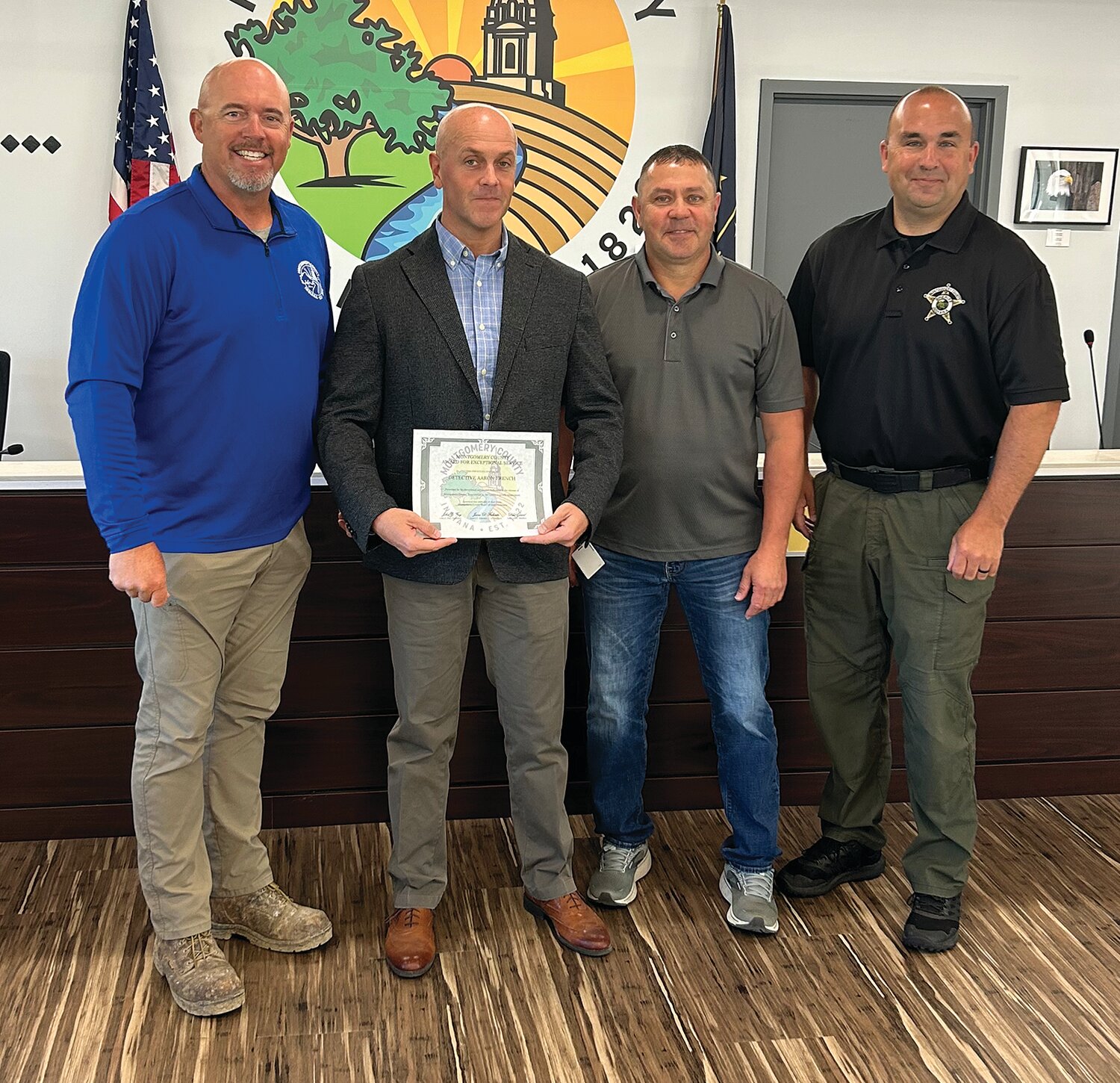 Montgomery County Sheriff Detective Aaron French, second from left, was presented Tuesday with a certificate of appreciation for his work on a multi-state child pornography and child exploitation case. The investigation resulted in the perpetrator receiving a 90-year prison sentence. Also pictured are Montgomery County Commissioners Dan Guard and Jim Fulwider and Montgomery County Sheriff Ryan Needham.