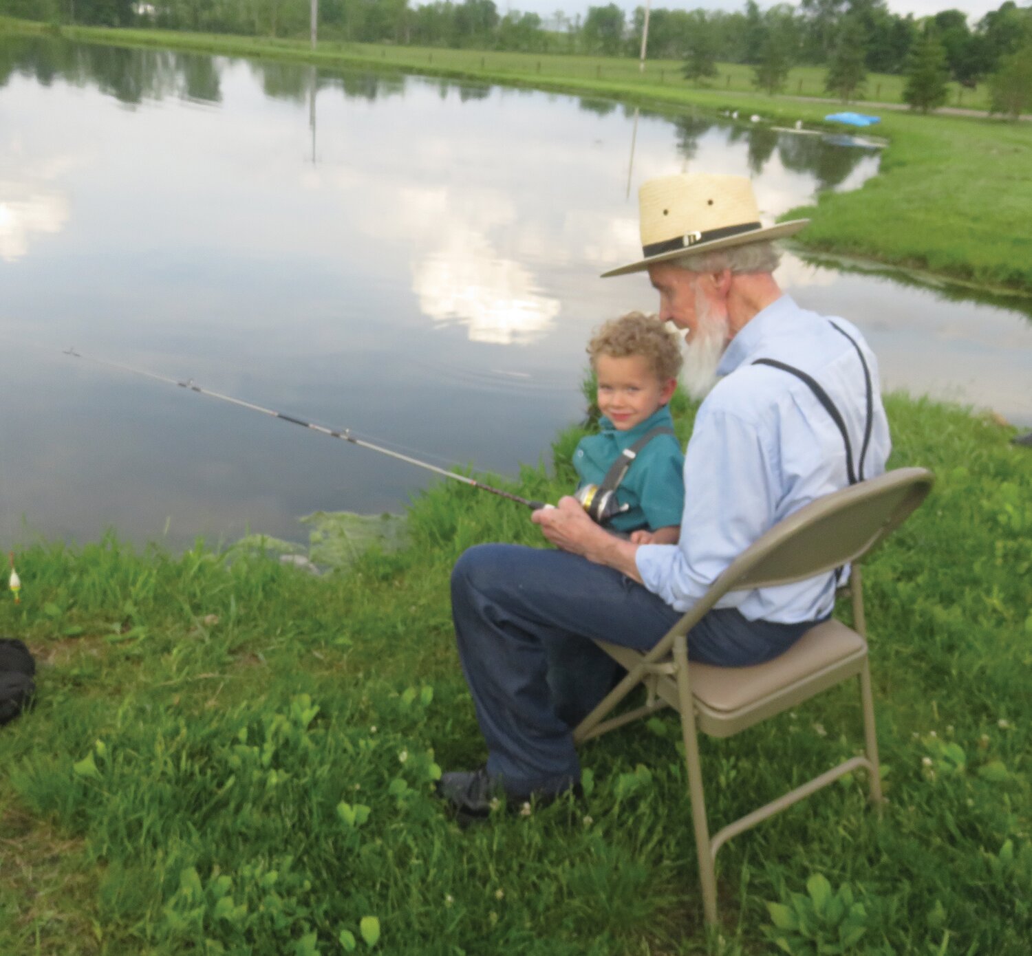 Joshua and Grandpa Tobe, 90, fishing.