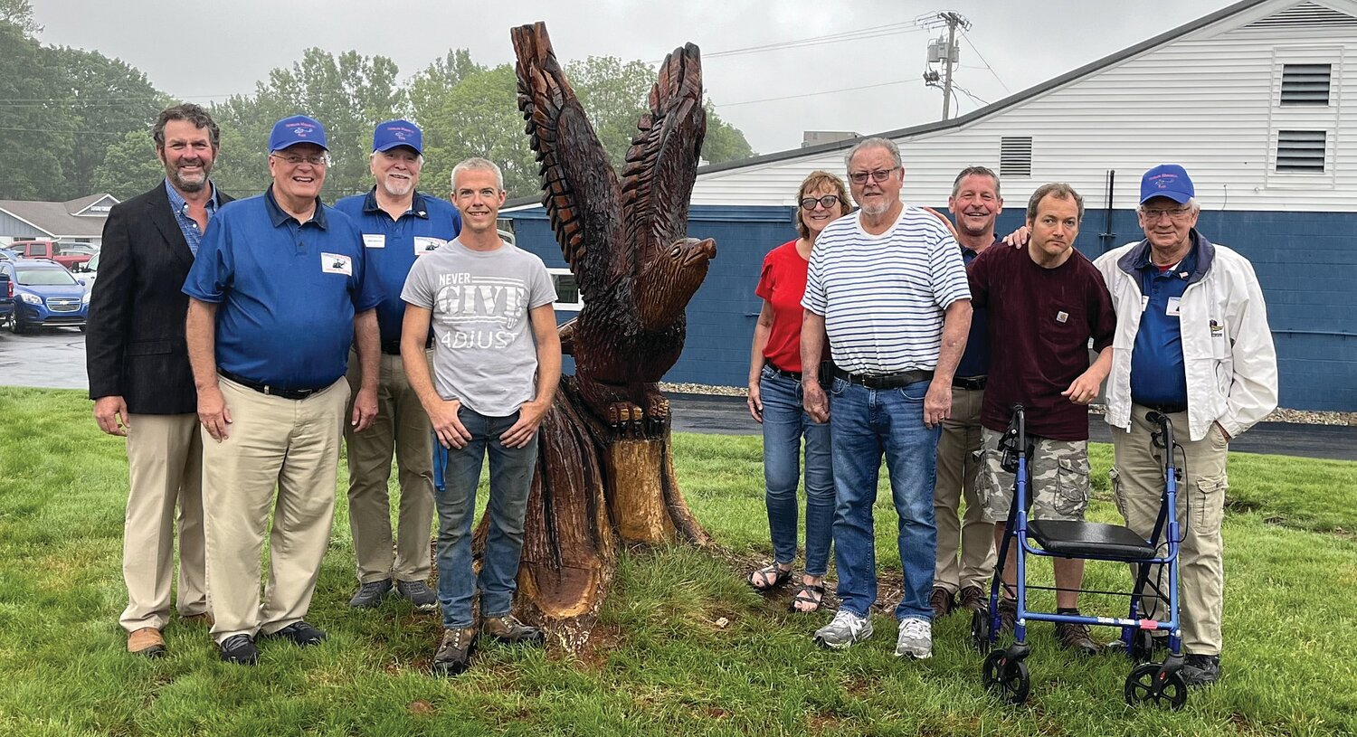 Photo Provided
Veterans Memorial Park President Kevin Cobb, board advisor Mark Eutsler, vice president Mike Spencer, artist Jesse Melvin, donors Angel and Larry Cooper, VMP board member John Douglas, donor Skyler Sells and VMP secretary Bill Durbin celebrate the completion of the American Eagle sculpture created by Melvin, a chainsaw artist, and funded through a $550 gift from the Coopers and Sells. It was sculpted from the stump that remained from a dying tree that was removed from the park. VMP is organized as a not-for-profit corporation and is recognized as tax-exempt by the IRS under Section 501(c)(3). Its mission is “Honoring All Veterans.” Various parts of the park and its operation are available for sponsorship and underwriting, including purchasing bricks that will surround the center monument. Engraved bricks will recognize veterans and those who support veterans. More information is available on the park’s Facebook page—Veterans Memorial Park – Crawfordsville.