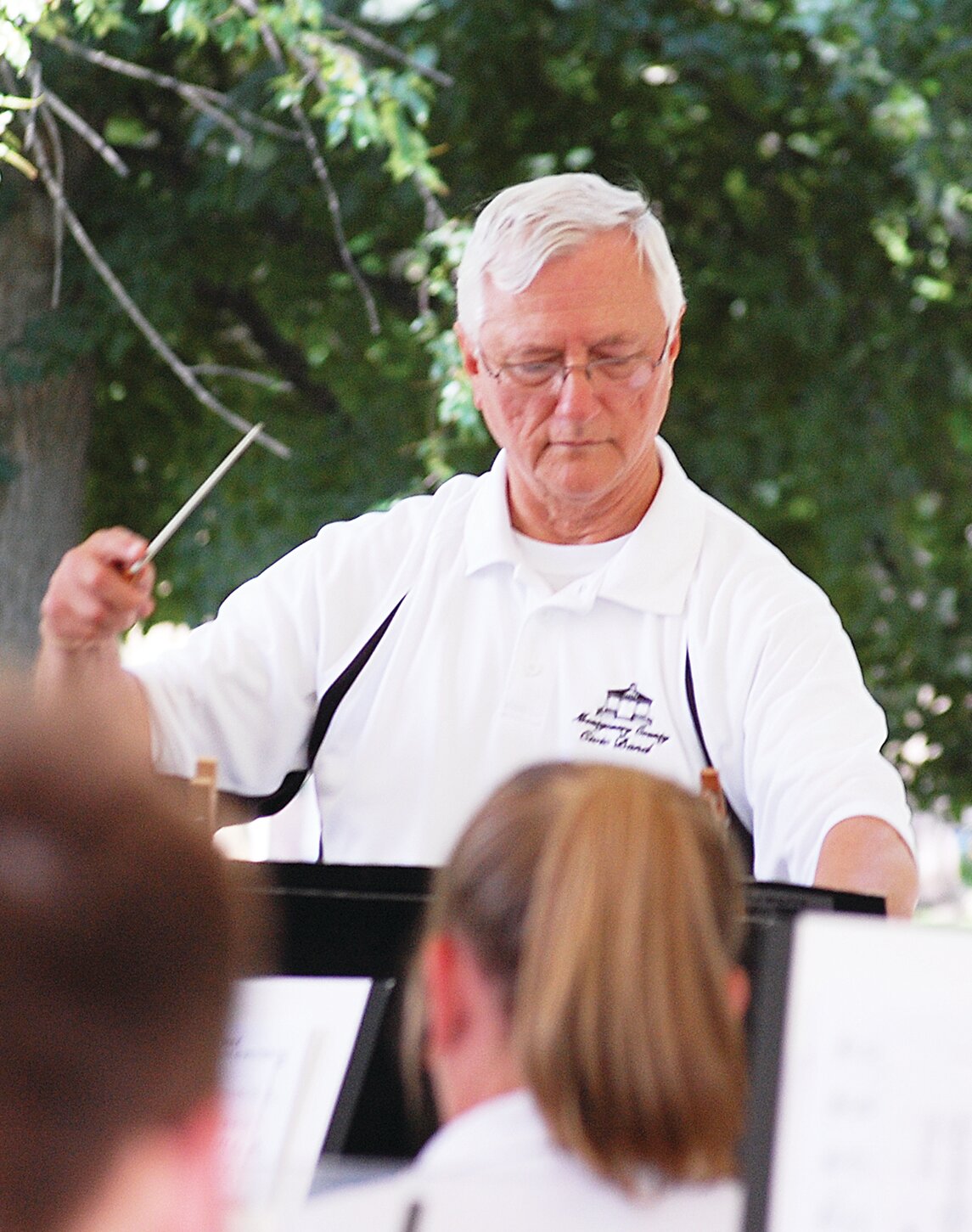 Montgomery County Civic Band director Gary Ketchum directs the band.