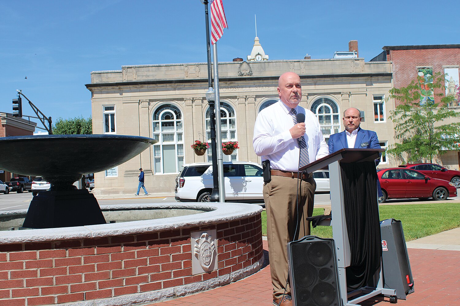 Mayor Todd Barton addresses the crowd gathered Wednesday at the ribbon cutting ceremony for the Crawford Fountain.