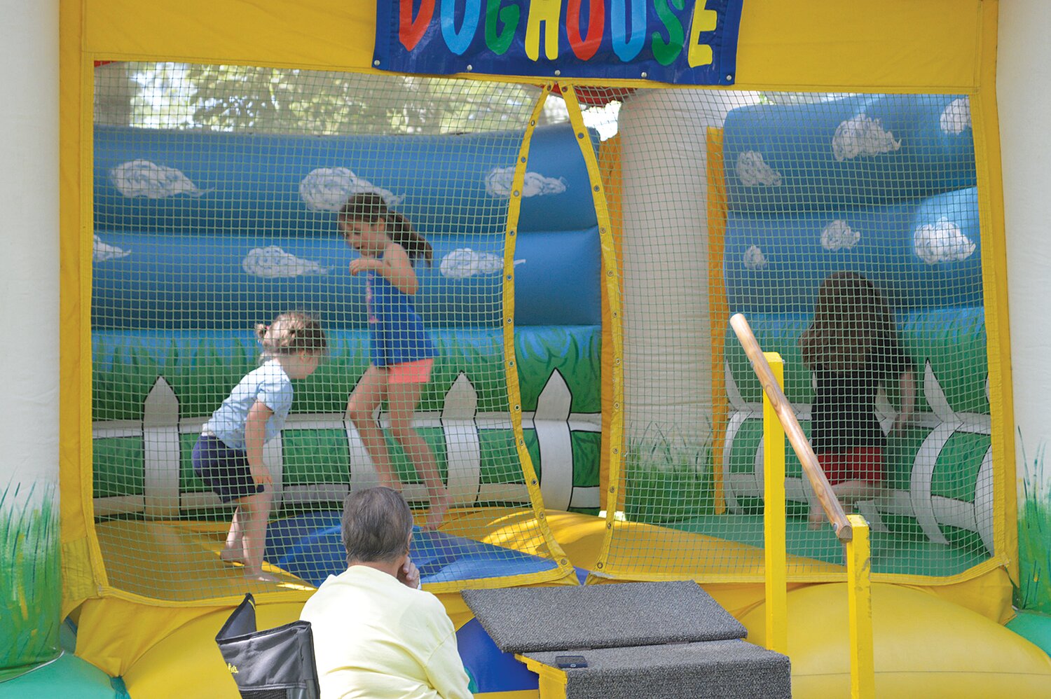 The bounce house is a popular destination in the Children's Area.