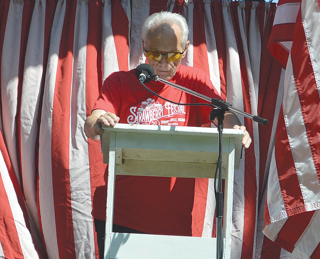 S. David Long, festival chairman, addresses the crowd during opening ceremonies Friday.