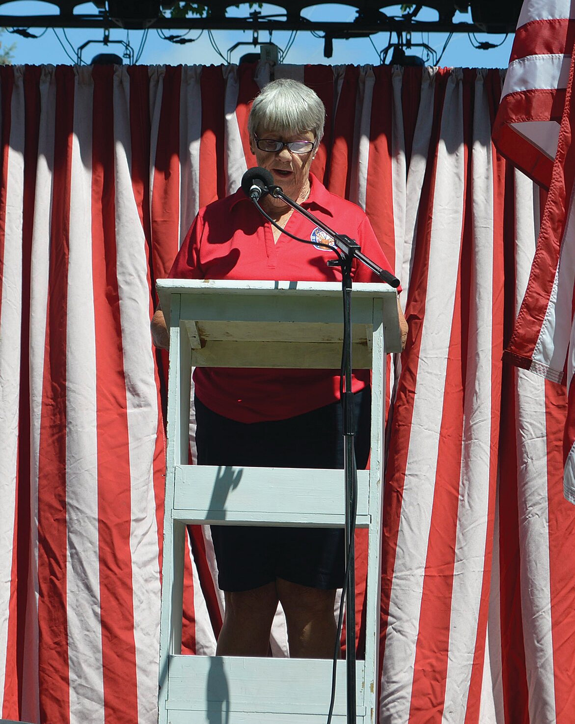 Judy Consoer participates in the Flag Day ceremony.