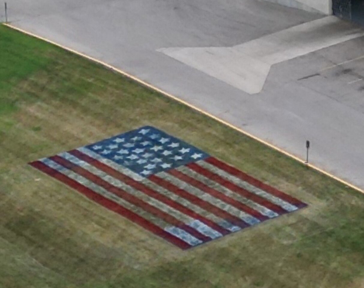 CPM painted an American flag in the side yard facing Oak Street.