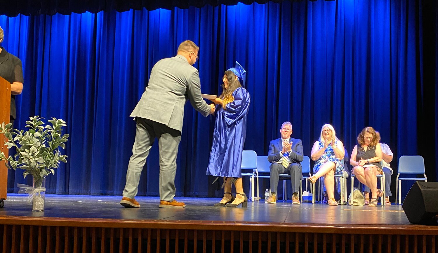 Crawfordsville Superintendent Dr. Rex Ryker distributes diplomas to CARA graduates.