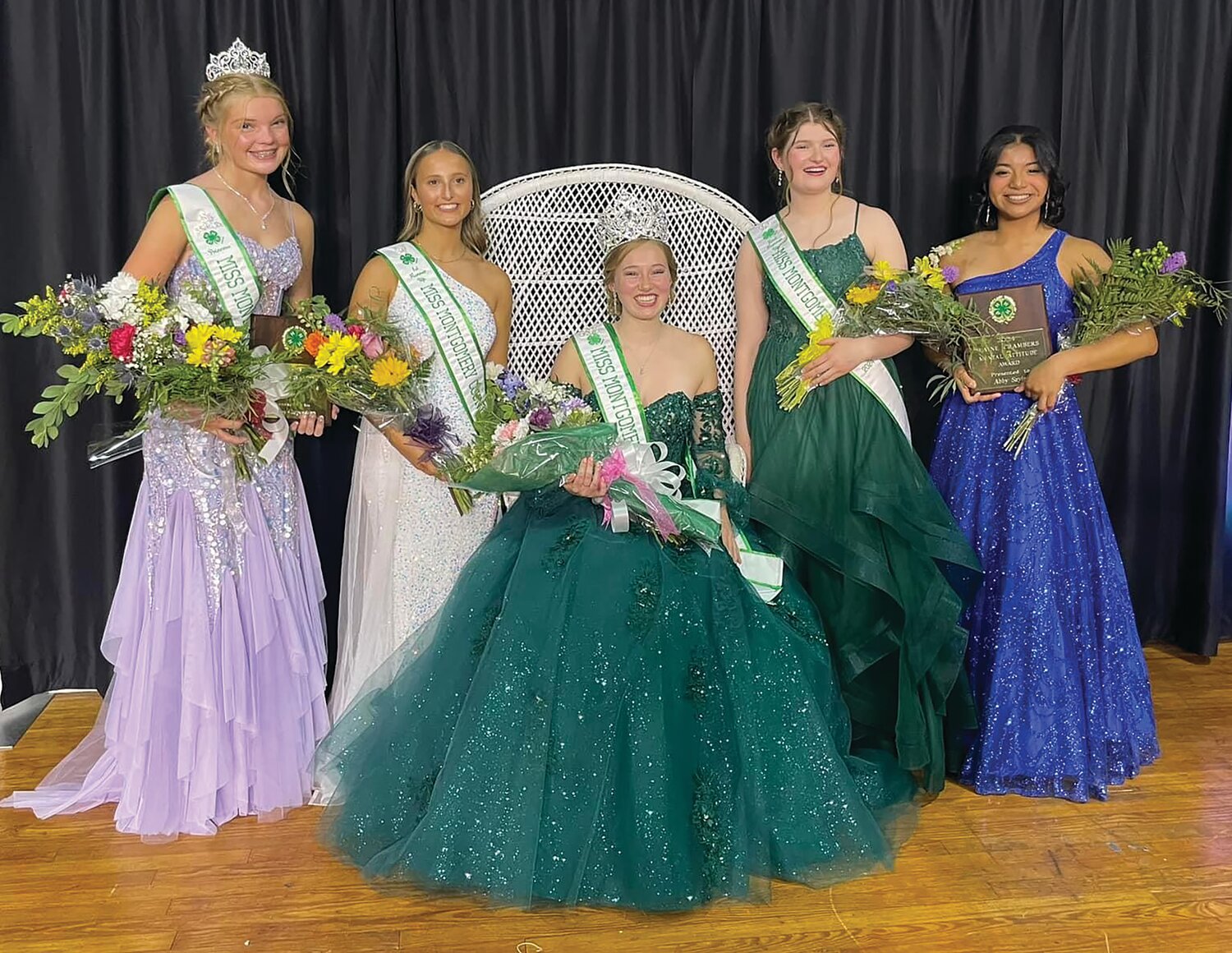 Jessie Bradley, seated, was named the 2024 Miss Montgomery County and Miss Congeniality on Saturday. She is pictured with her court, from left, Princess Caelyn Carpenter; first runner-up Peri McClaskey; second runner-up Miranda Crowe; and Abby Sayler, who along with Carpenter, earned the Elaine Chambers Mental Attitude Award. Bradley is the daughter of Brian and Pam Bradley. She is a recent Southmont High School graduate and will be a freshman this fall at Purdue University. She is a 10-year 4-H member whose projects have included goats, swine, sheep, sewing, Fashion Revue, foods, crafts and floriculture. Bradley and her court will reign over the Montgomery County 4-H Fair, which begins Friday and continues through July 17.
