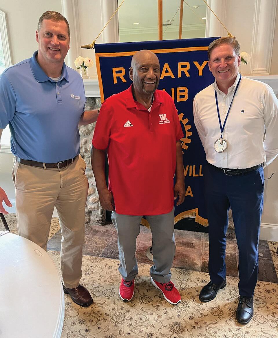 Rob Johnson, retired Track and Field and Cross Country coach at Wabash College, spoke to the Crawfordsville Rotary Club at their noon meeting. Johnson told of his journey from the East Coast to the cornfields of Indiana and Wabash College. He began his career in 1971 at Wabash College, coaching football for one year. He then began coaching Track and Field and Cross Country. Johnson spent the fall of 2000 as one of the U.S. Track and Field coaches at the 2000 Sydney Olympics. “My experiences, and those of Wabash men who have participated in the Olympic trials, show that you can come to Wabash and be a part of the Olympic process. It can happen.” He is pictured with Dr. Michael Scheidler, left, and Tom Klein.