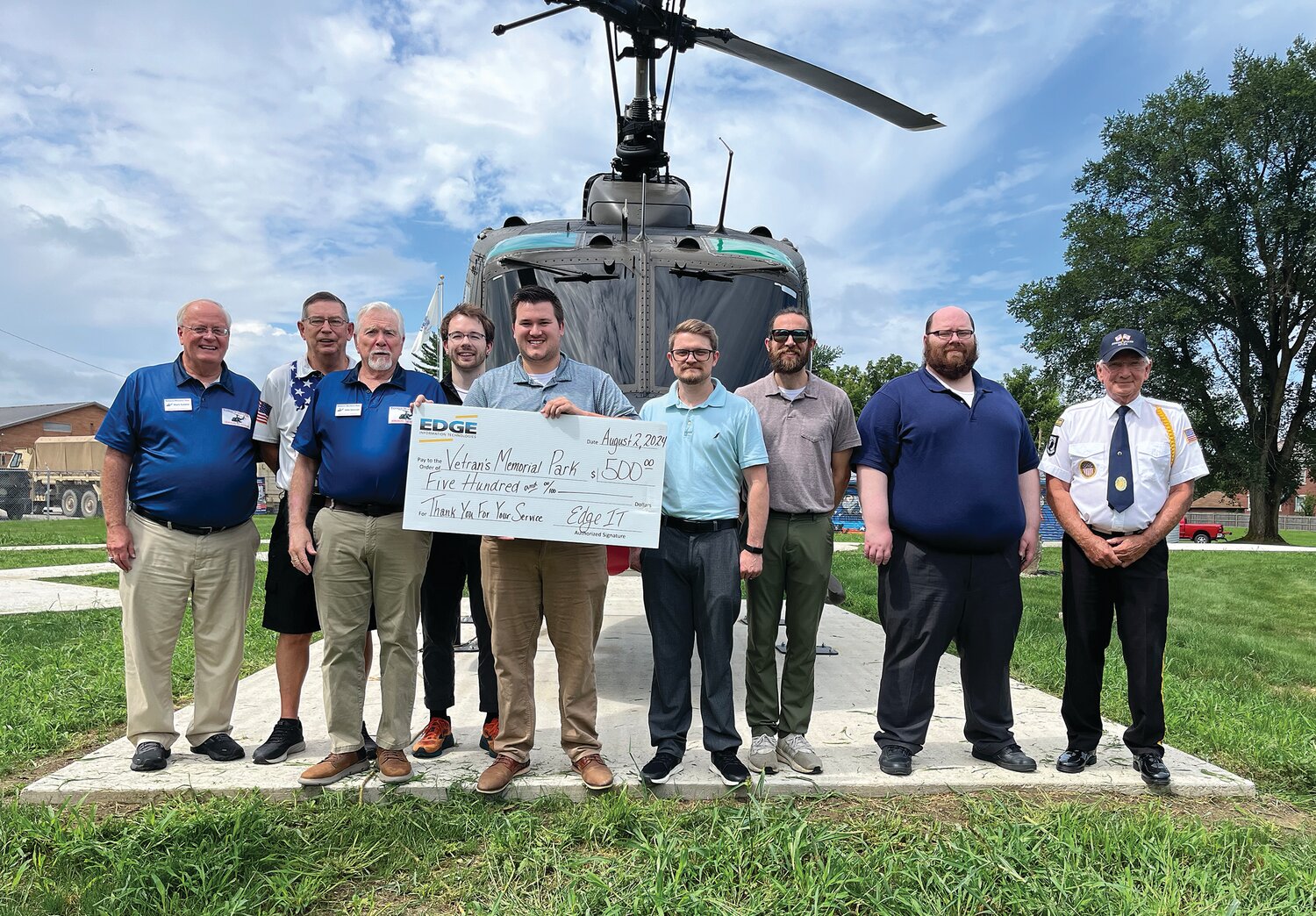 Veterans Memorial Park Board Member Mark Eutsler, VMP Treasurer Marc Gabel, VMP Vice President Mike Spencer; EDGE Information Technologies Associates John Maynard, Brendan Bratcher, Jason Hartwick, Jacob Corbin, and Aaron Wesley; and VMP Secretary Bill Durbin celebrate EDGE’s support of the Veterans Memorial Park in Crawfordsville. VMP is organized as a not-for-profit corporation and is recognized as tax-exempt by the IRS under Section 501(c)(3). Its mission is “Honoring All Veterans.” Various parts of the park and its operation are available for sponsorship and underwriting, including purchasing bricks surrounding the center monument.  Engraved bricks will recognize veterans and those who support veterans. More information is available on the park’s Facebook page — “Veterans Memorial Park – Crawfordsville.”