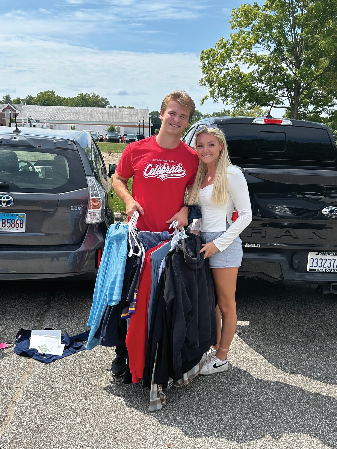 Wabash College sophomore football player Luke Cushing from Downers Grove, Illinois, receives help from Lauren Whiley moving onto campus Monday.