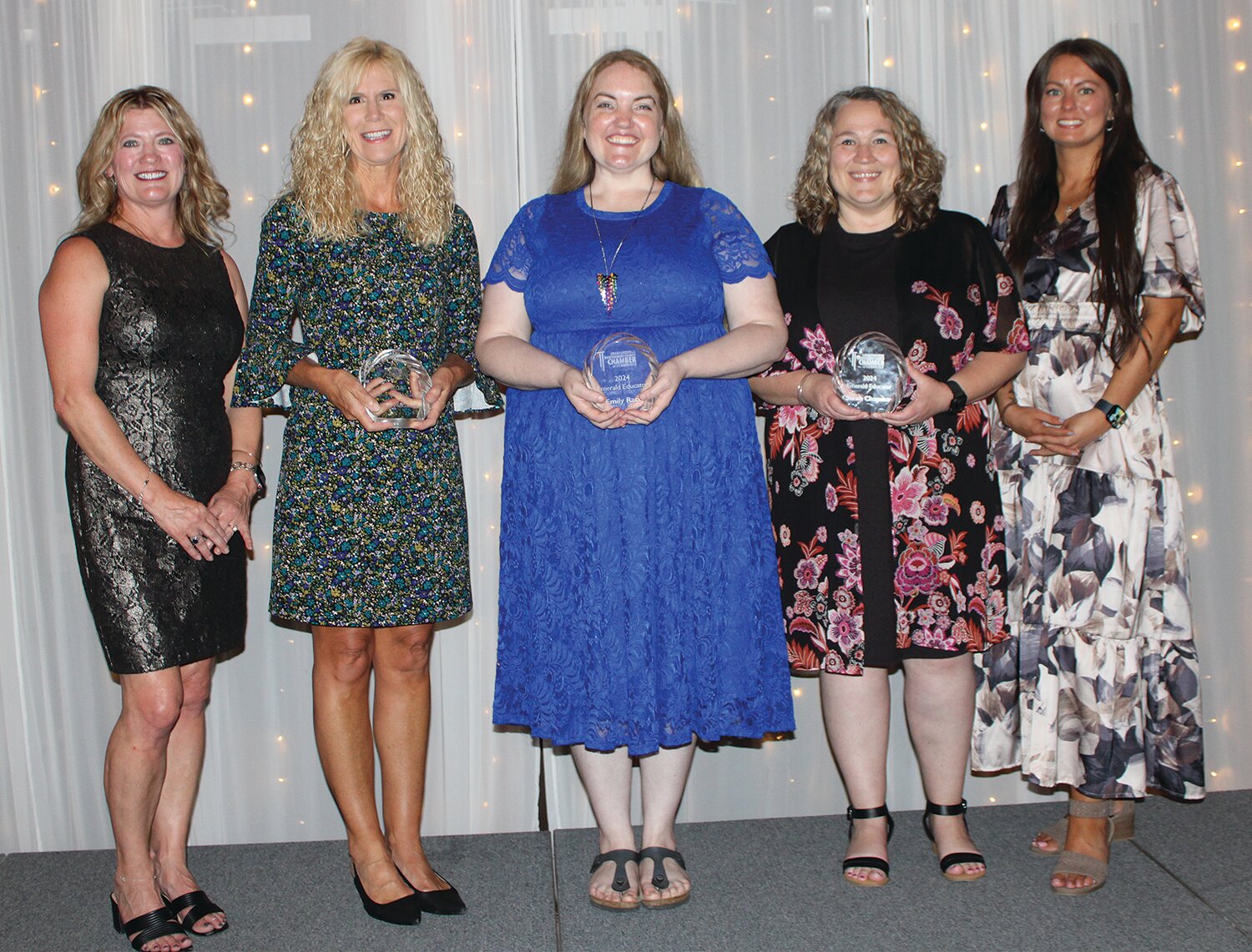 Recipients of the Emerald Educator Award are Tammy McGaughey of Ladoga Elementary School, second from left, Emily Race of Crawfordsville High School, center, and Sarah Chapman of Pleasant Hill Elementary School. They are pictured with Stacy Sommer, far left, and KyLee Risner, far right.