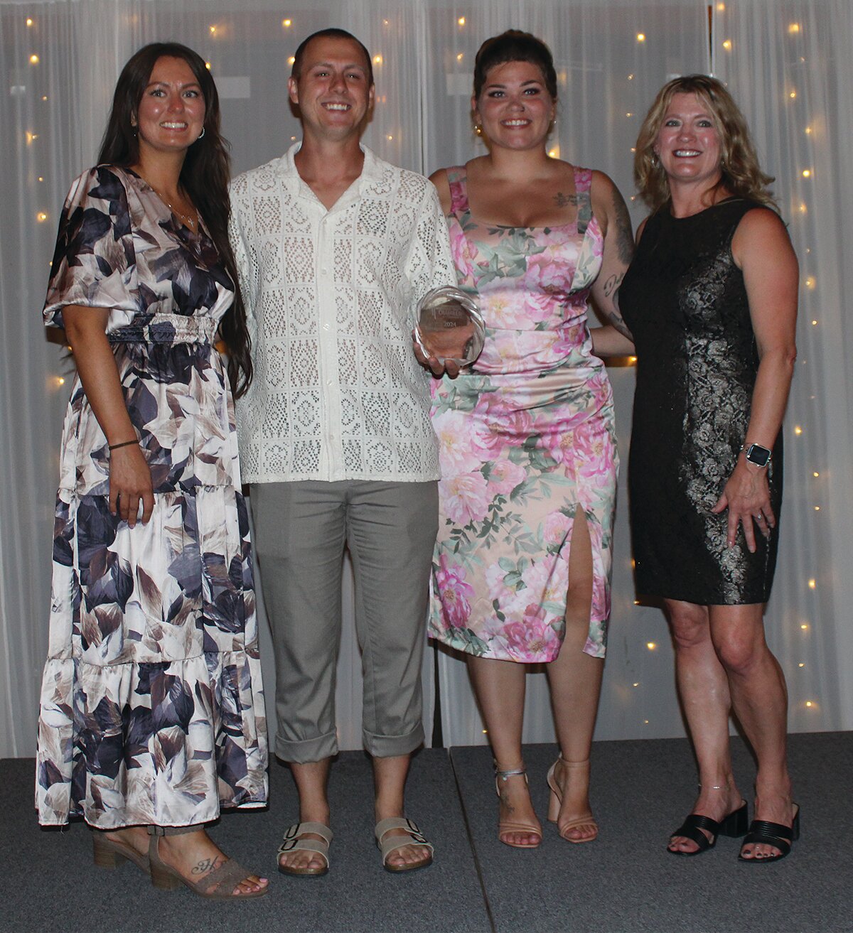 Kelvin and Courtney Smith-Dalton, owners of Smitty D's Gourmet Hot Dog Cart, won the 2024 Entrepreneur of the Year Award. They are pictured with KyLee Risner, left, and Stacy Sommer.