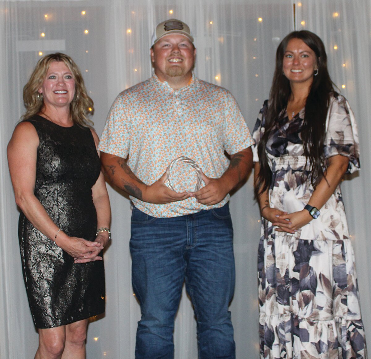 Cody Proctor, center, owner of Oak Hat Co., was awarded the 2024 Rising Star Young Professional Award. He is pictured with Stacy Sommer, left, and KyLee Risner.