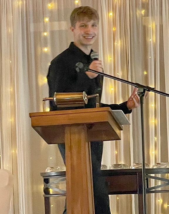 Keynote speaker and Greek's Pizzeria owner Jacob Szumski addresses the audience gathered for the annual awards dinner.