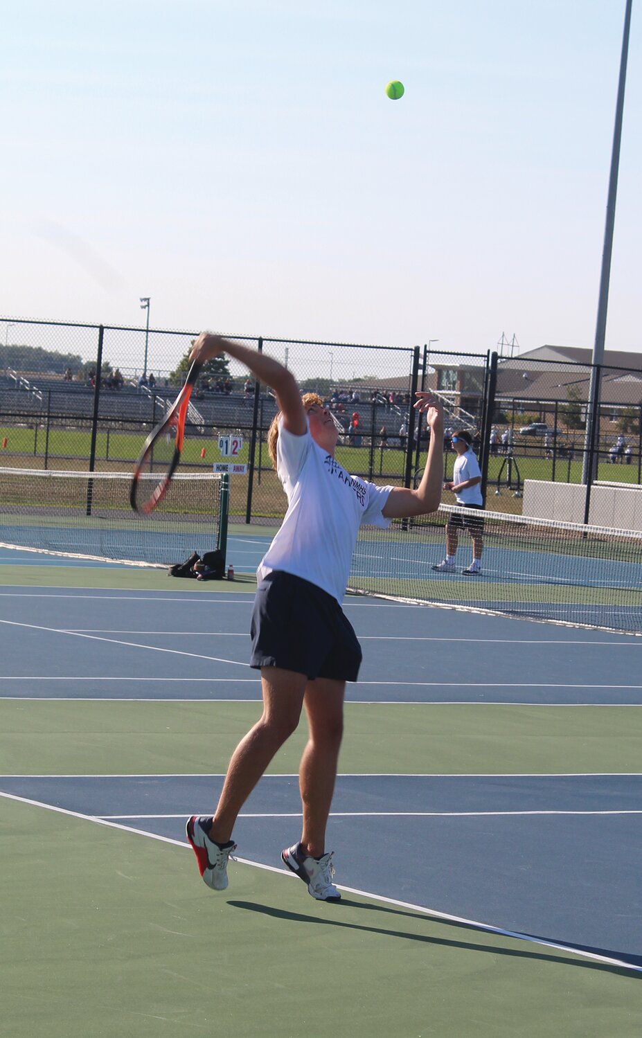 North Montgomery No. 1 singles player Beckett Martin serves a ball against Fountain Central on Monday. The Mustangs went on to defeat the Chargers 4-1.