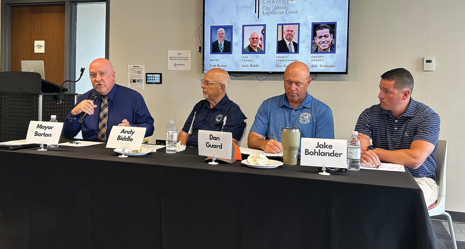 Pictured, from left, are Mayor Todd Barton, Crawfordsville City Council President Andy Biddle, Montgomery County Commissioner Dan Guard and Montgomery County Councilman Jake Bohlander. The local legislators participated Friday in a panel discussion sponsored by the Crawfordsville/Montgomery County Chamber of Commerce.