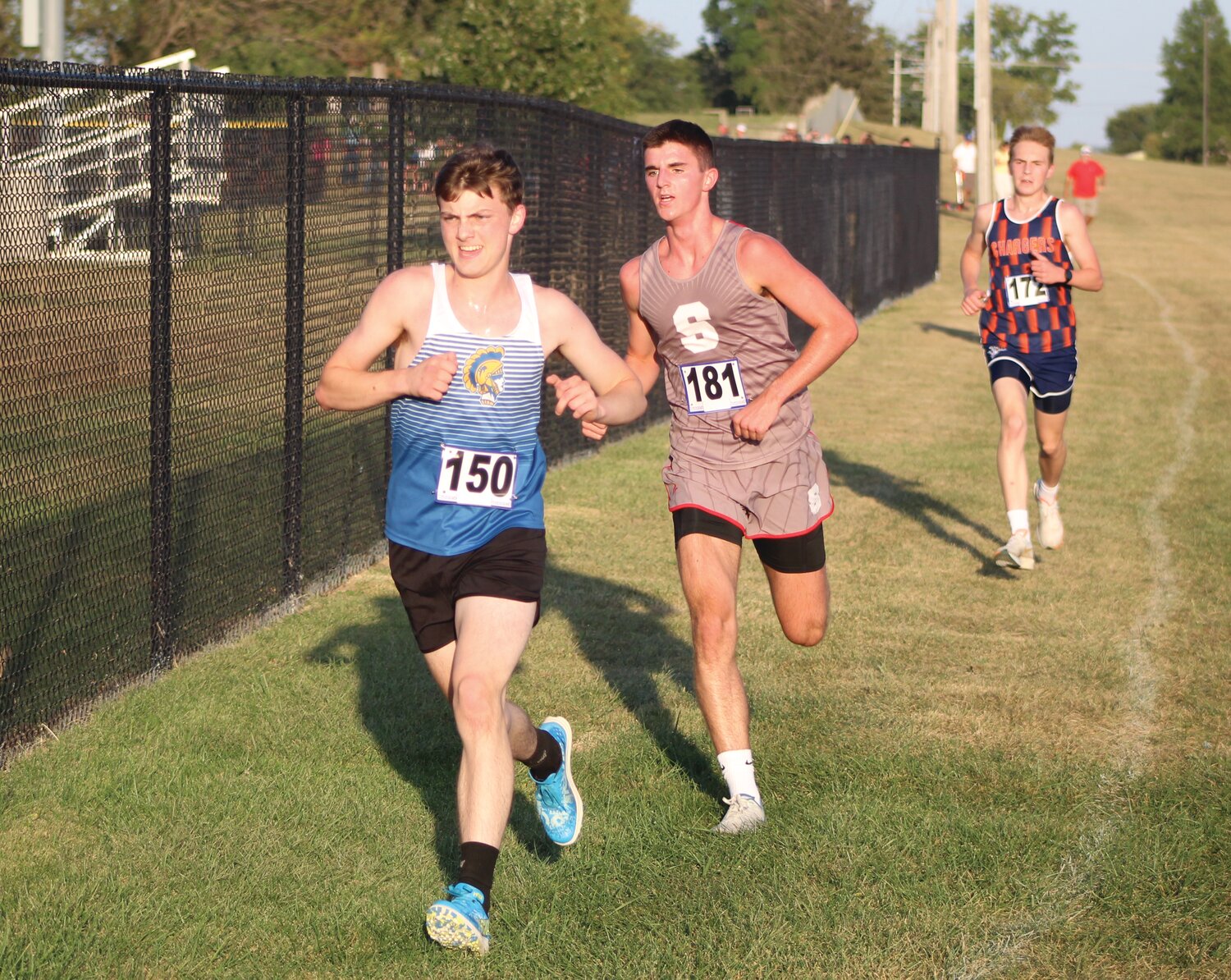 From left, Crawfordsville's Hutton Haas battles Southmont's Vince Reimondo and North Montgomery's Jack Rogers at the Montgomery County Cross Country Meet.