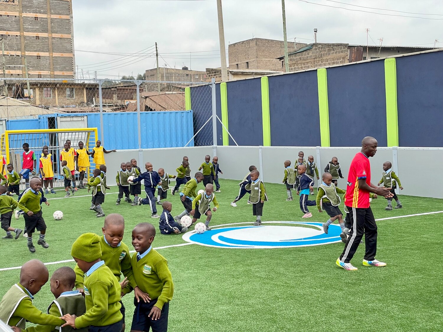 Children playing on the soccer field.