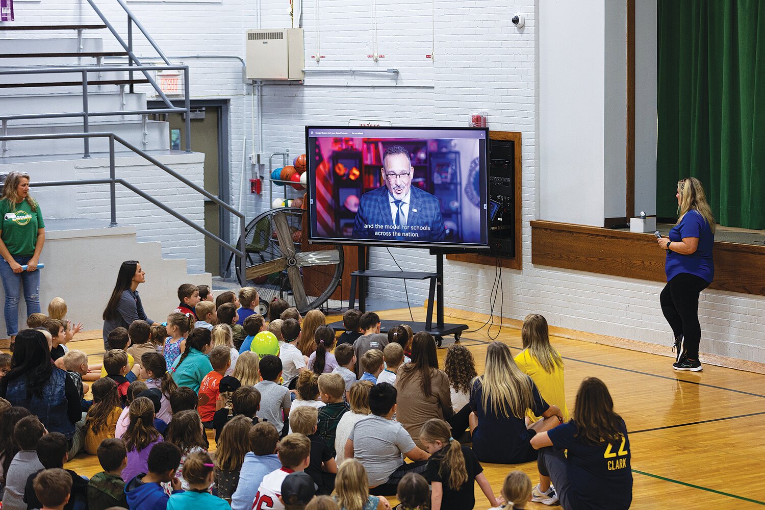 Ladoga students listen to a prerecorded message about the national Blue Ribbon School award.