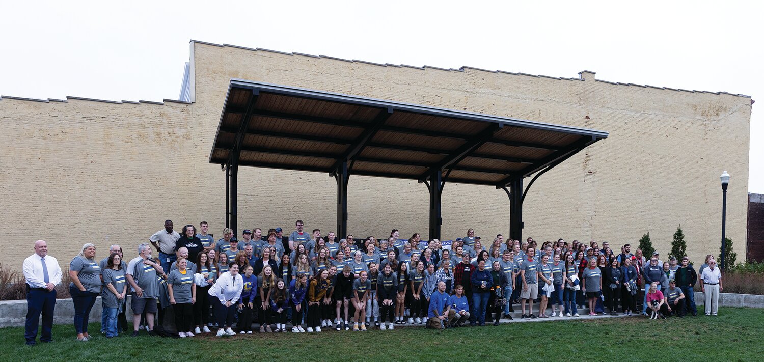 Mayor Todd Burton poses Wednesday with volunteers who attended the Community Day of Service event organized by the Montgomery County Leadership Academy.