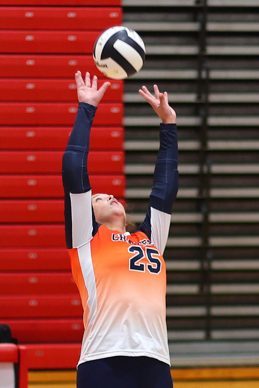 Piper Ramey of North Montgomery sets the ball.