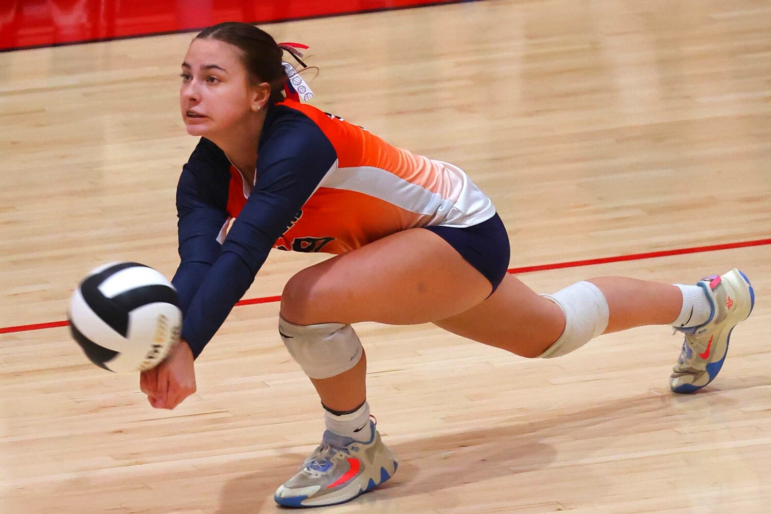 Claire Sennett of North Montgomery digs out a serve.