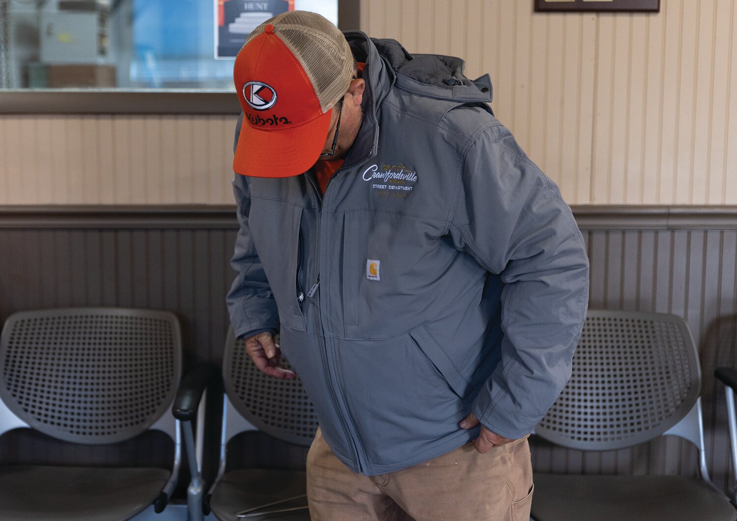 Larry Hunt poses in his new jacket and hat from the Crawfordsville Street Department on Friday.