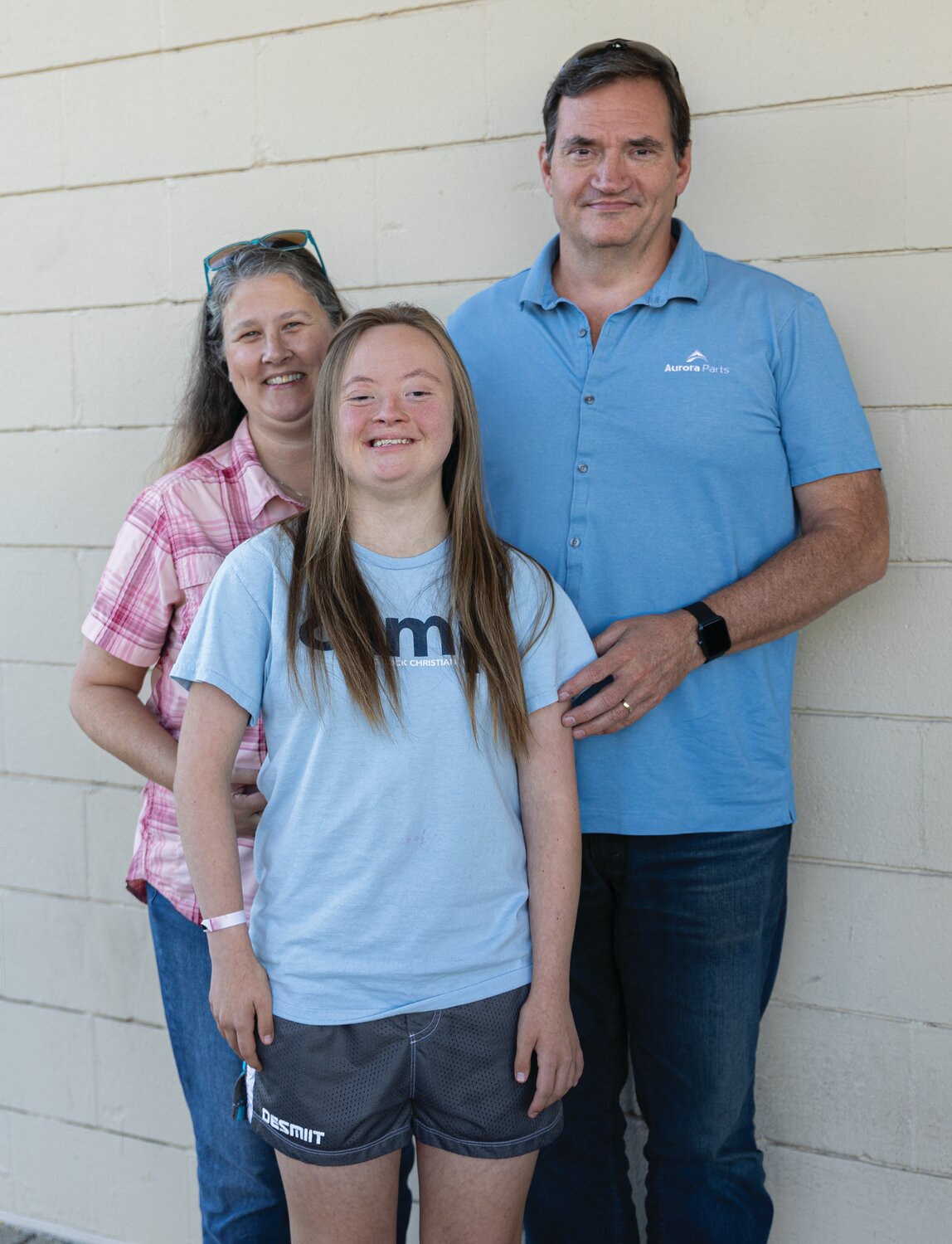 Maddie Lewellyn posing with her parents, Candy Lewellyn and Chris Lewellyn, Oct. 2.