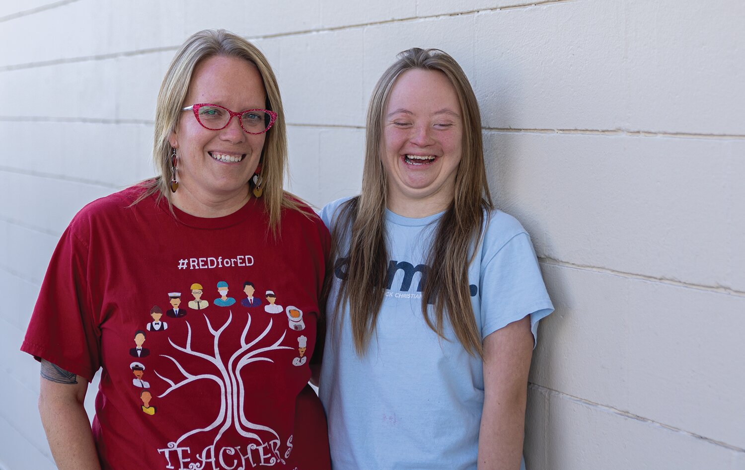 Maddie Lewellyn and her golf coach, Erin Gilland, posing, Oct. 2.