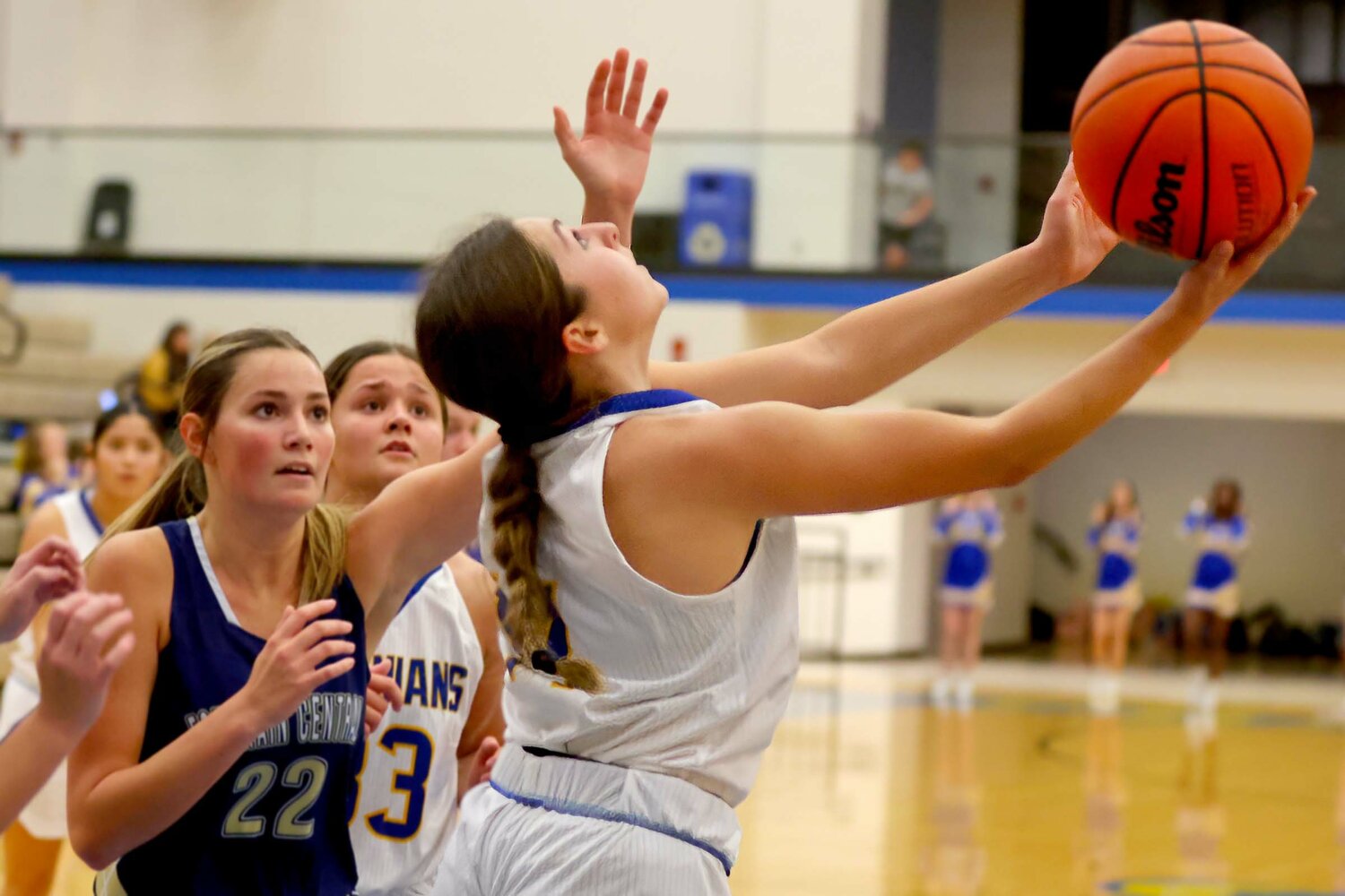 Aubrey Lowe of Crawfordsville shoots a reverse lay-up against the defense of KayLee Spragg of Fountain Central.