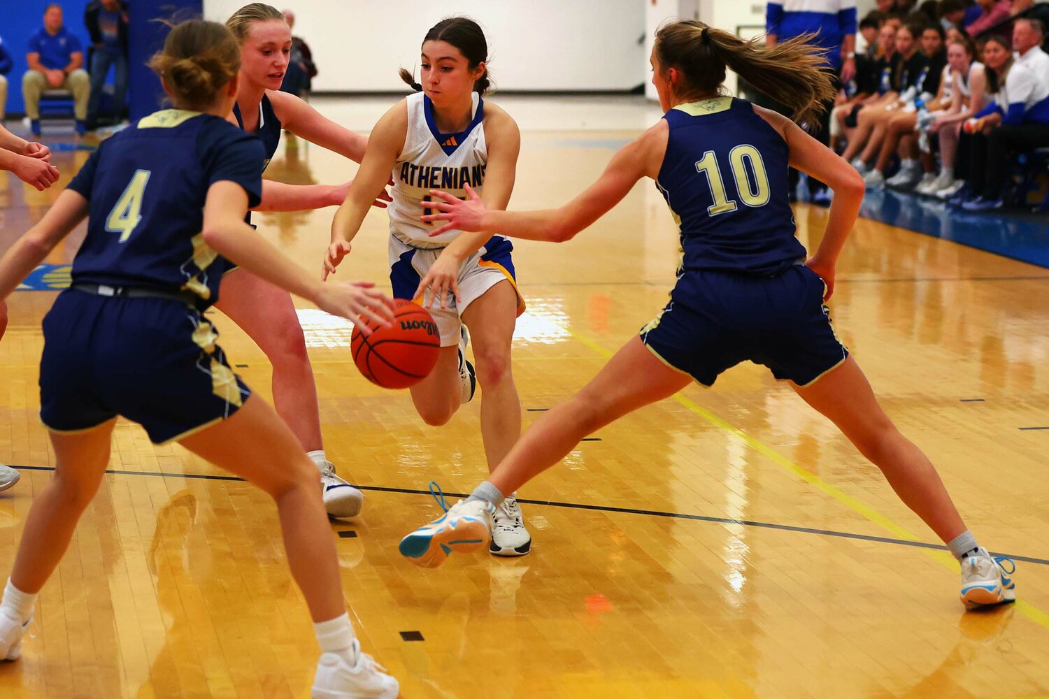 Aubrey Lowe of Crawfordsville drives through a trio of Fountain Central players.