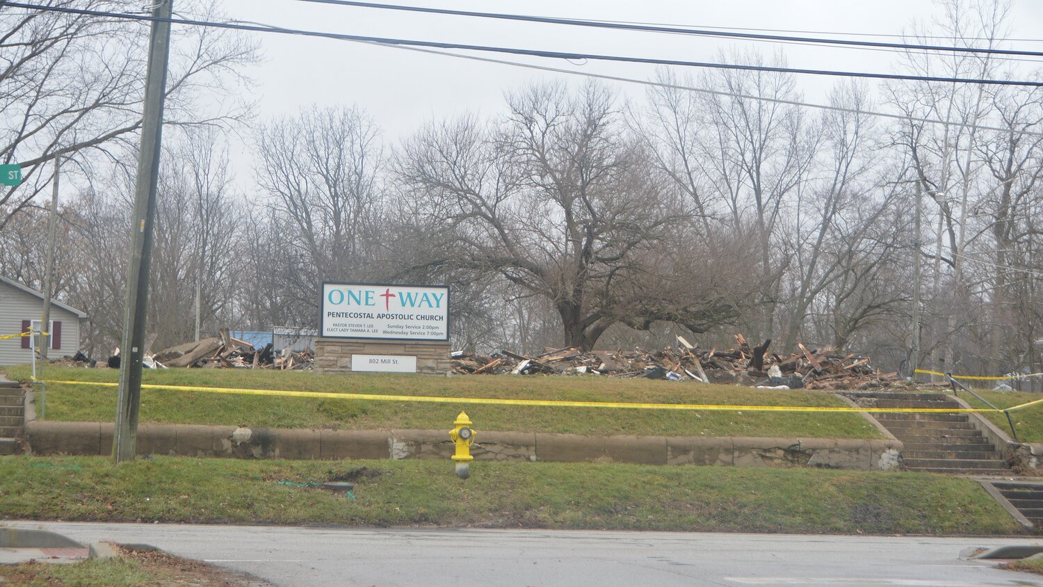 A pile of rubble is all that remains Friday at 802 Mill St. after a fire destroyed the former church building Thursday afternoon. Demolition crews worked quickly Friday to knock down the burned out structure that once housed One Way Pentecostal Apostolic Church, and before that Milligan Memorial Presbyterian Church. The fire, which originated in the basement of the vacant church building, remains under investigation by local authorities as well as the Indiana State Fire Marshal's Office.