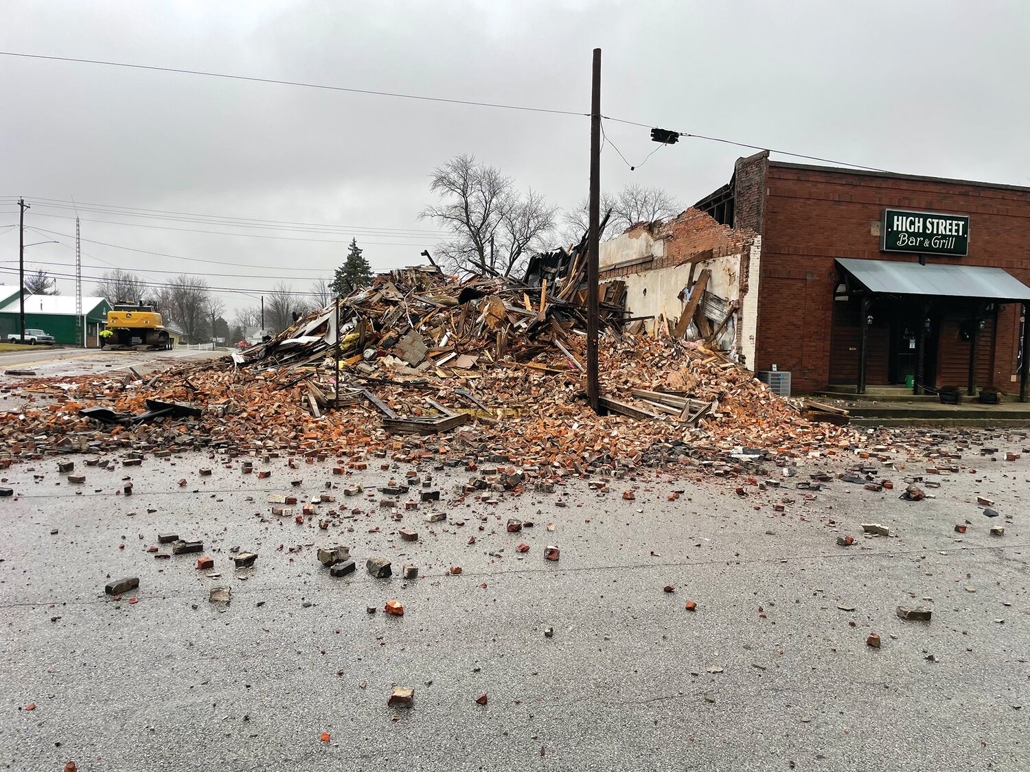 A vacant building at southwest corner of Vine and High streets in Wingate collapsed Sunday morning. The demise of the structure also damaged the adjacent High Street Bar.