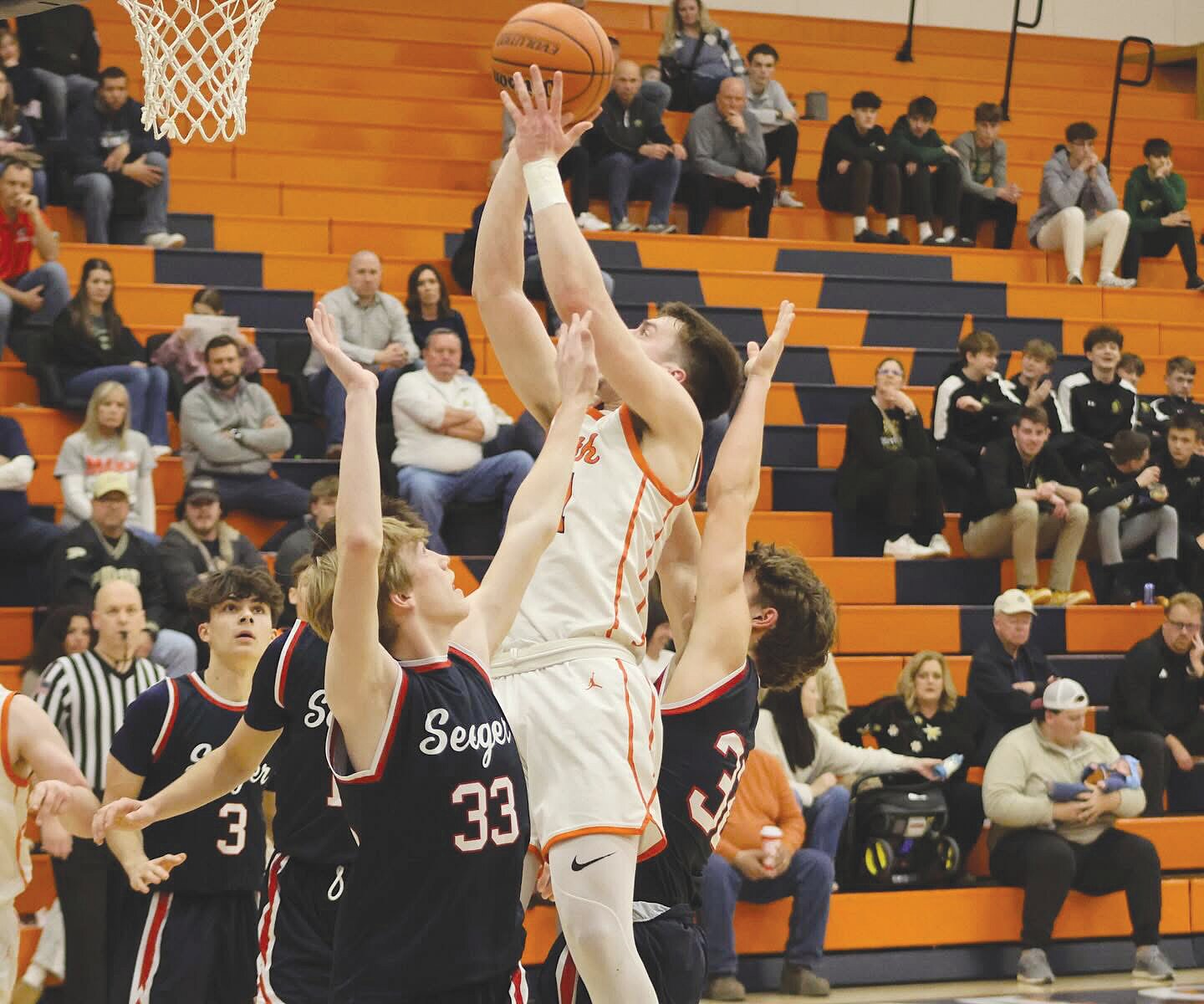 North’s Kelby Harwood puts up a shot Tuesday against Seeger in the first round of the sectional tournament. The senior ends his career with 1,179 points for the Chargers.