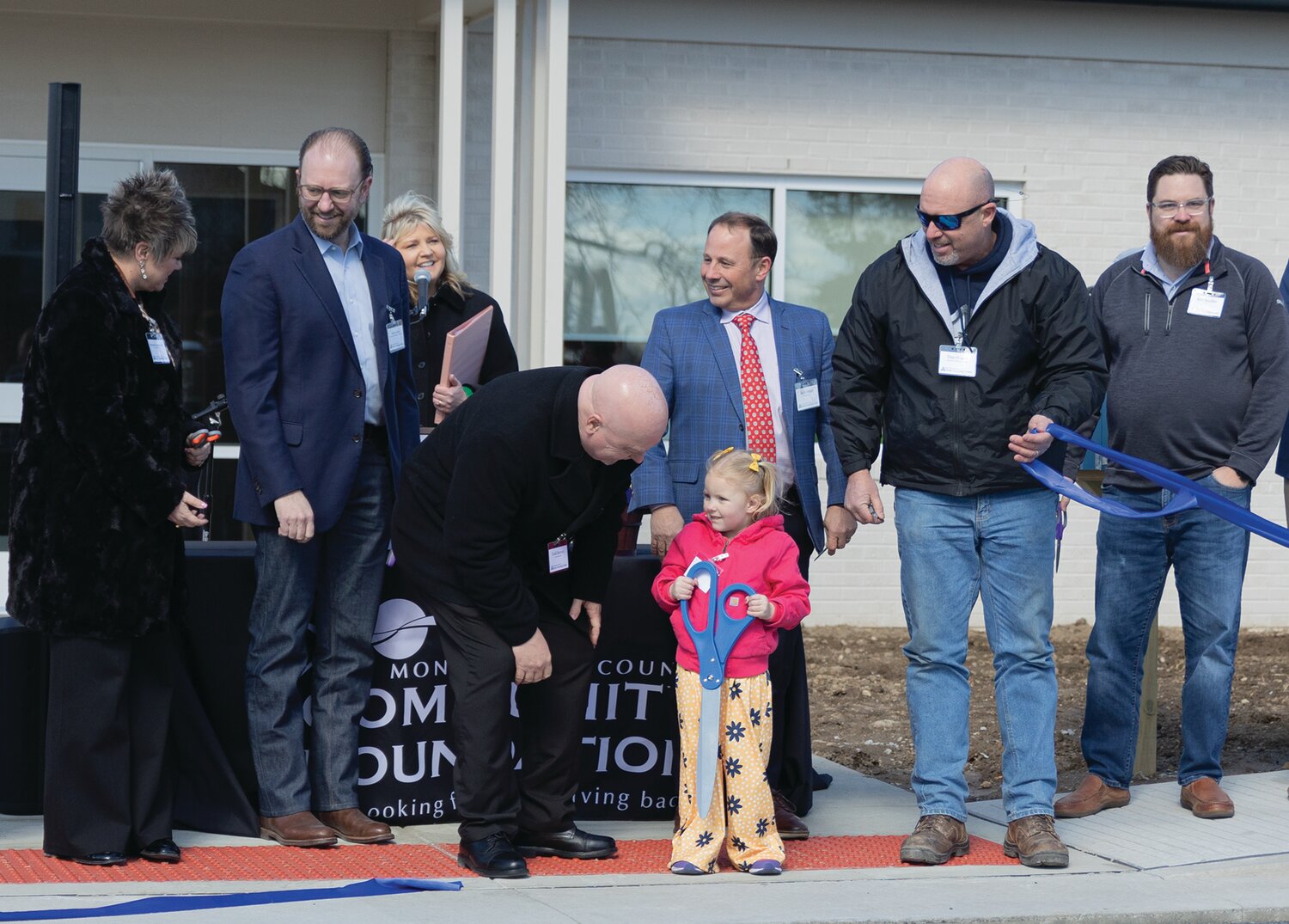 Partners and investors of the Montgomery County Early Learning Center, including Mayor Todd Barton, joined 3-year-old pre-K student Matilda Pence in cutting the ribbon during the ceremony on Thursday.View additional photos online at www.journalreview.com.