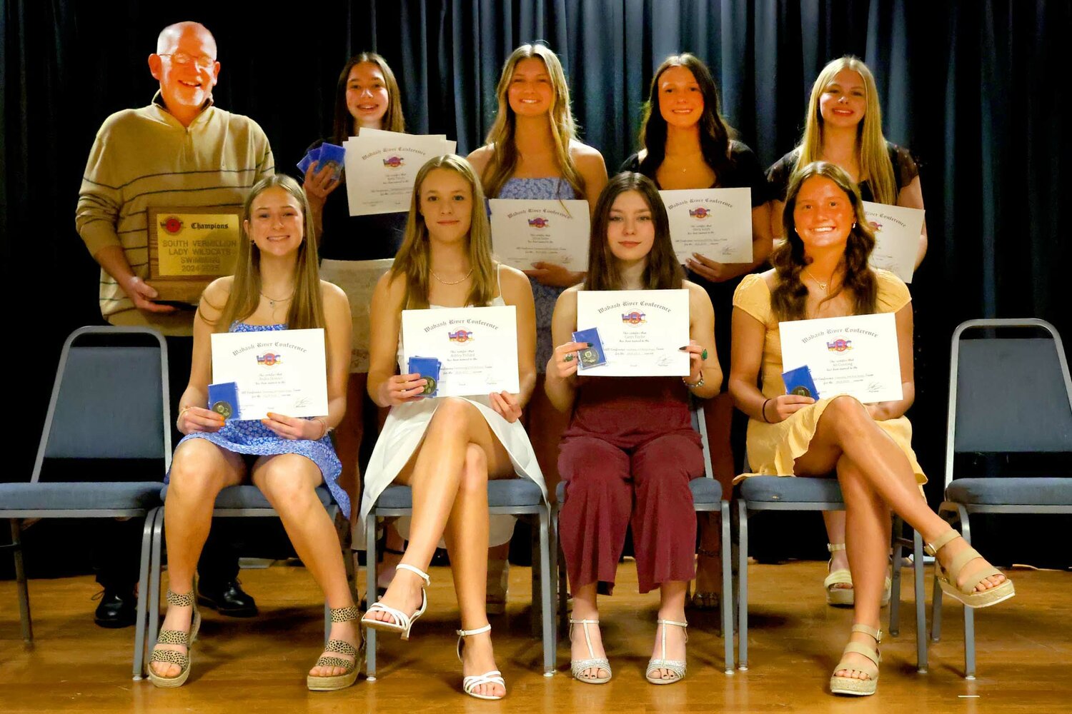 Members of the 2024-25 All-WRC girl’s swim and dive team are, from left, front row, Andra Skinner (SV), Ashley Pollard (SV), Carys Taylor (SV) and Ali Cunning (SV); and back row, Coach Kent Musall (SV), Alicia Guinn (SV), Olivia Smith (SV) and Layla Mackey (SV). Absent was Bella Hubner (S).